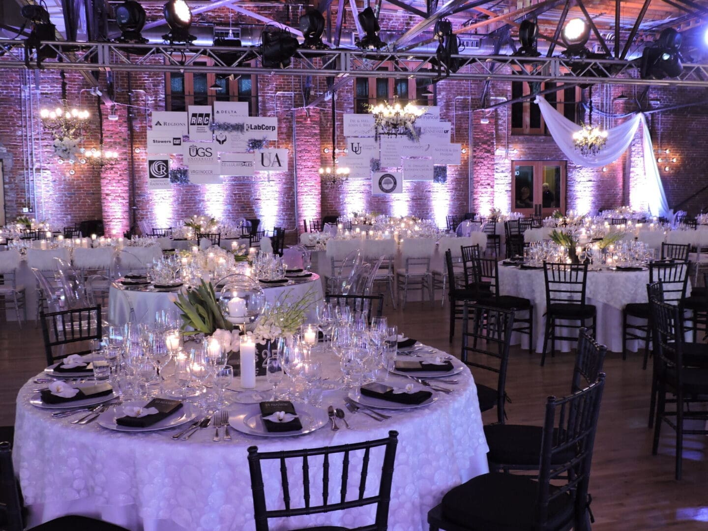 Elegant banquet hall with round tables set for a formal event.