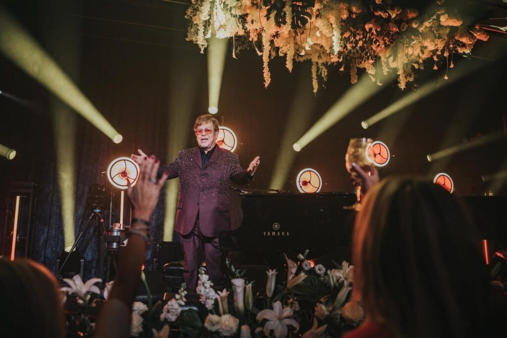 Elton John Performs on Stage at Concert.