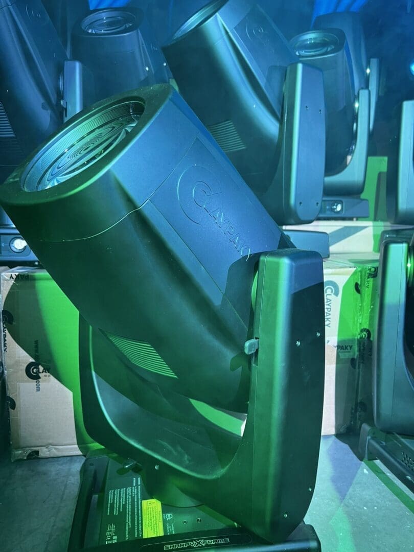 A green industrial machine part with a cylindrical opening.
