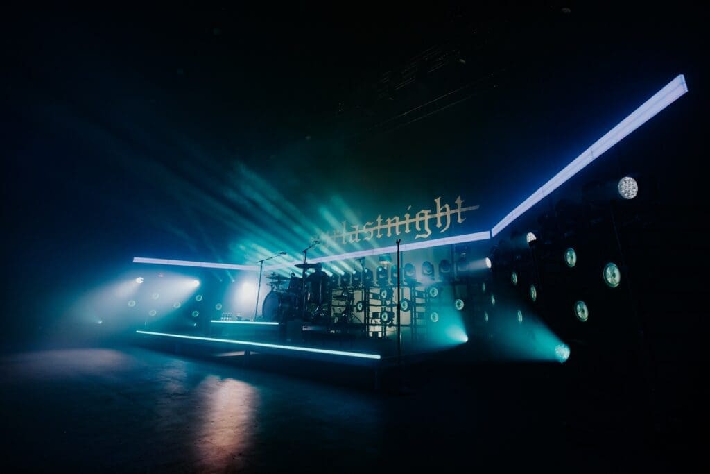 A futuristic nightclub scene with neon lights and a DJ booth.