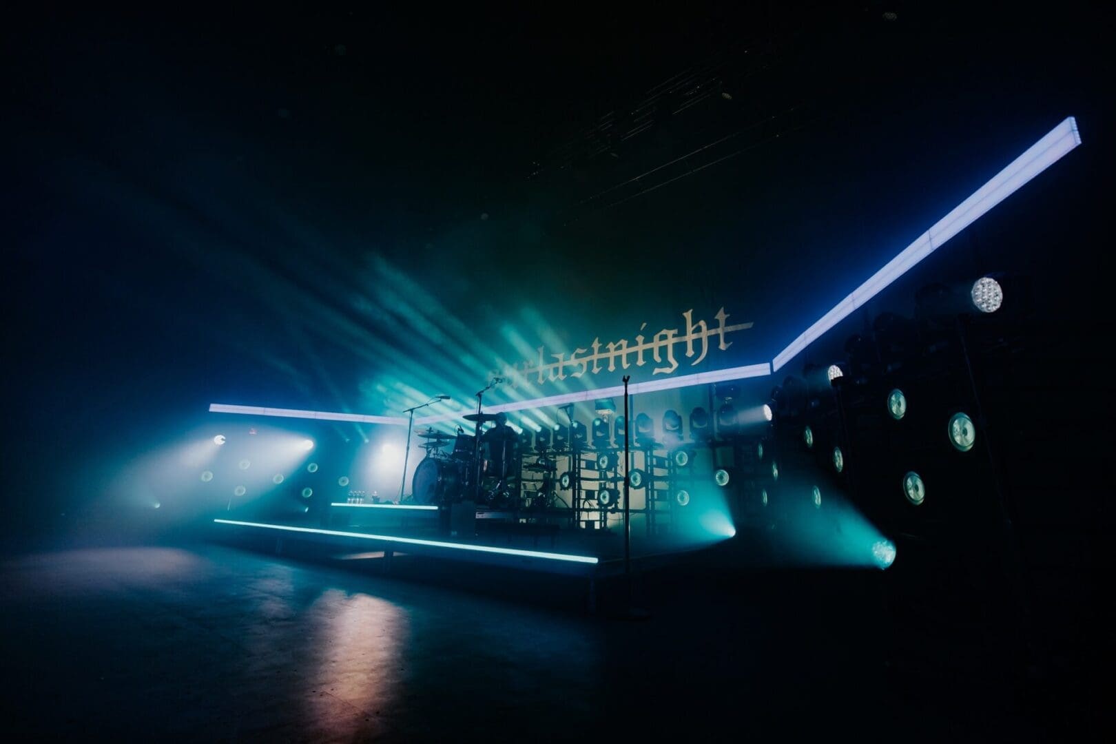 A futuristic nightclub scene with neon lights and a DJ booth.