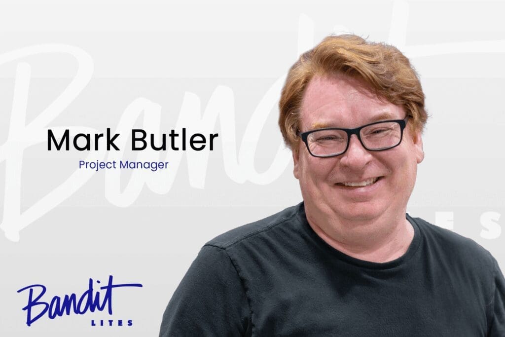 Portrait of Mark Butler, Project Manager, smiling confidently.