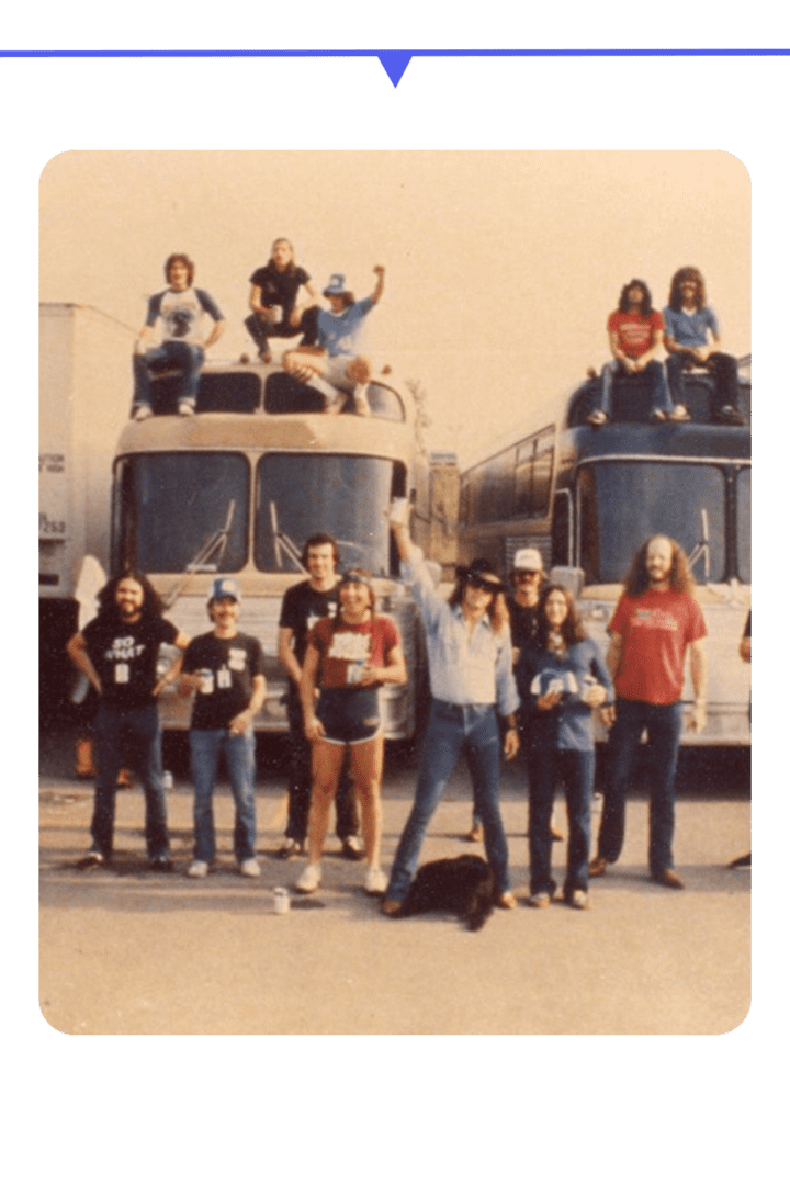 Group photo of young people posing on buses and ground, 1970s style.