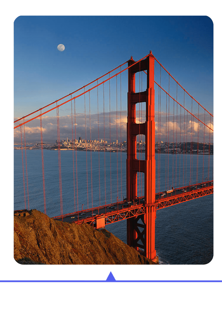 Golden Gate Bridge against a clear sky during sunset.
