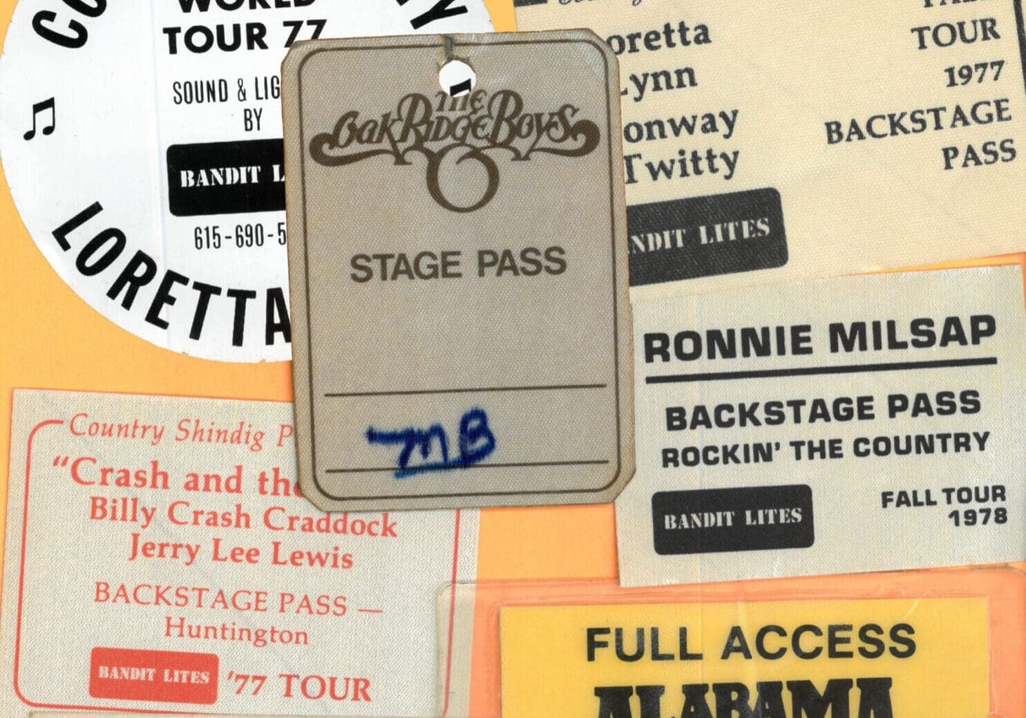 A vintage stage pass for the band Chicago from 1977 with handwritten notes.