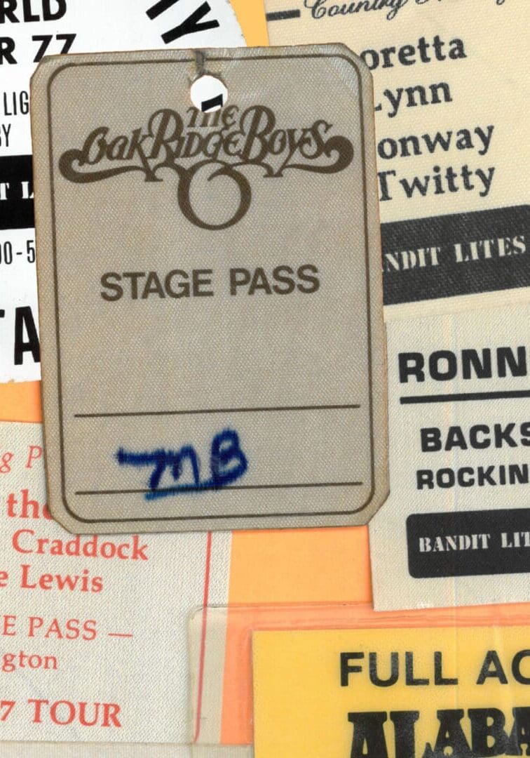 A vintage stage pass for the band Chicago from 1977 with handwritten notes.
