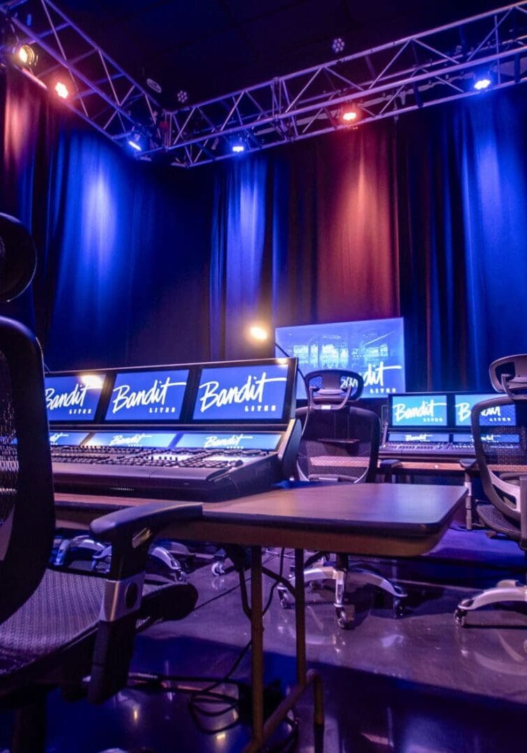 A high-tech gaming setup with multiple monitors and colorful LED lights.